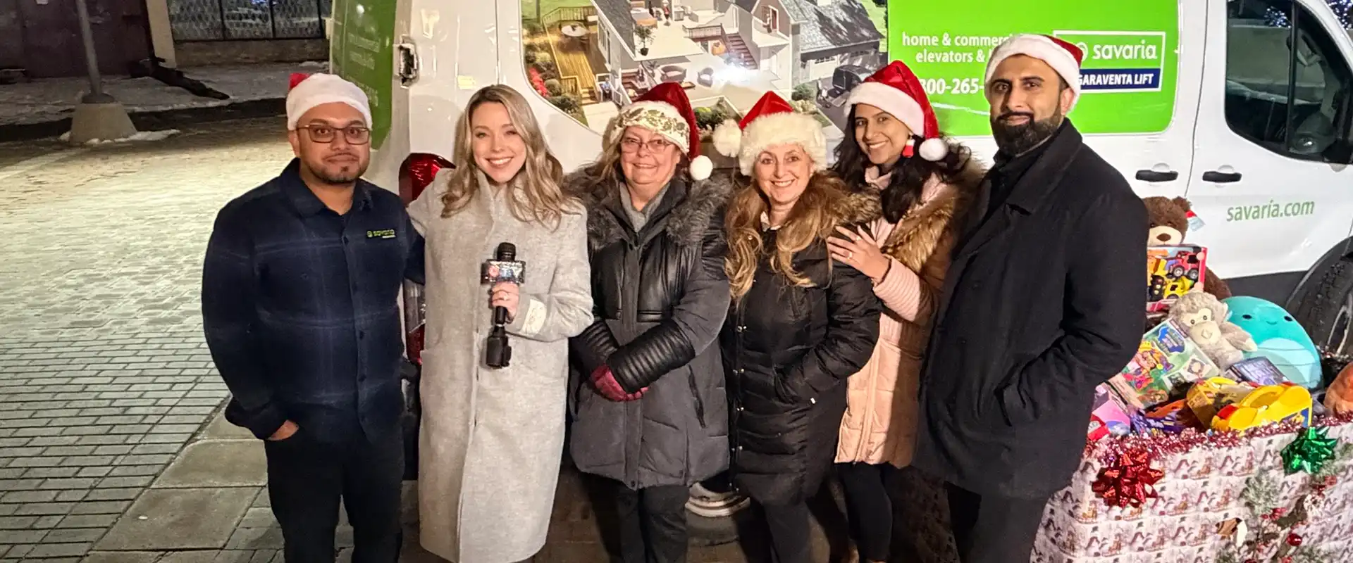 Savaria Brampton staff being interviewed by CTV for the Toys Run holiday drive