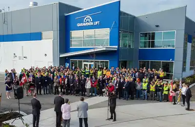 Group event with people standing outside Garaventa Lift building