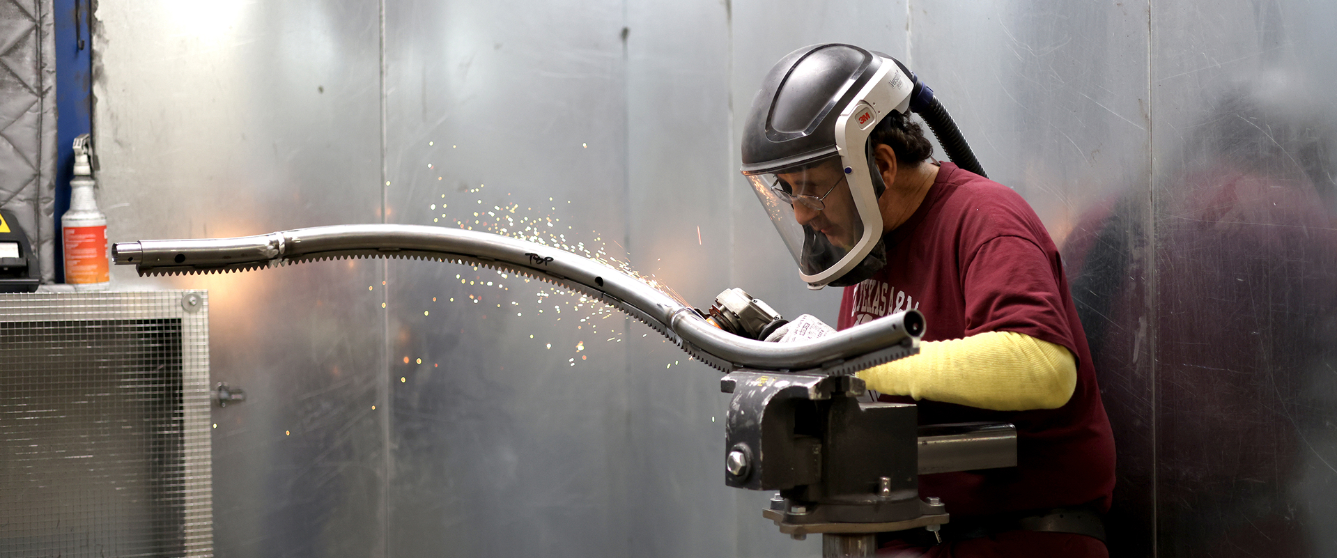 person working on a curved stairlift railing