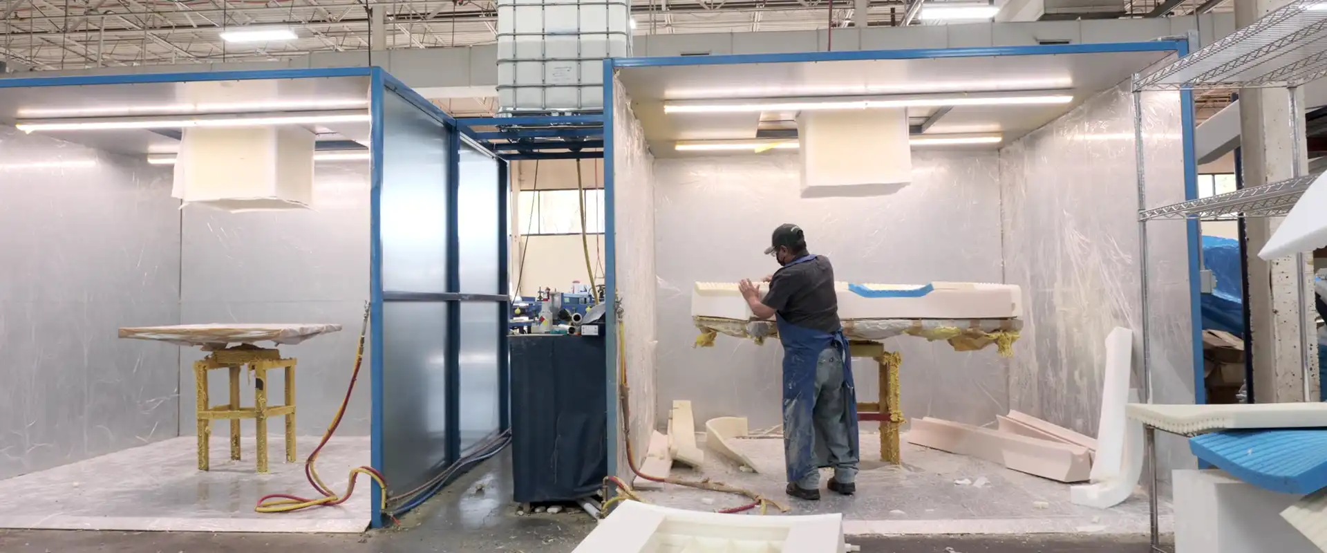 worker at SPAN manufacturing facility making hospital beds